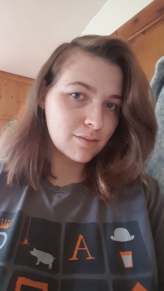 A picture of me, with shoulder length hair, in a tshirt